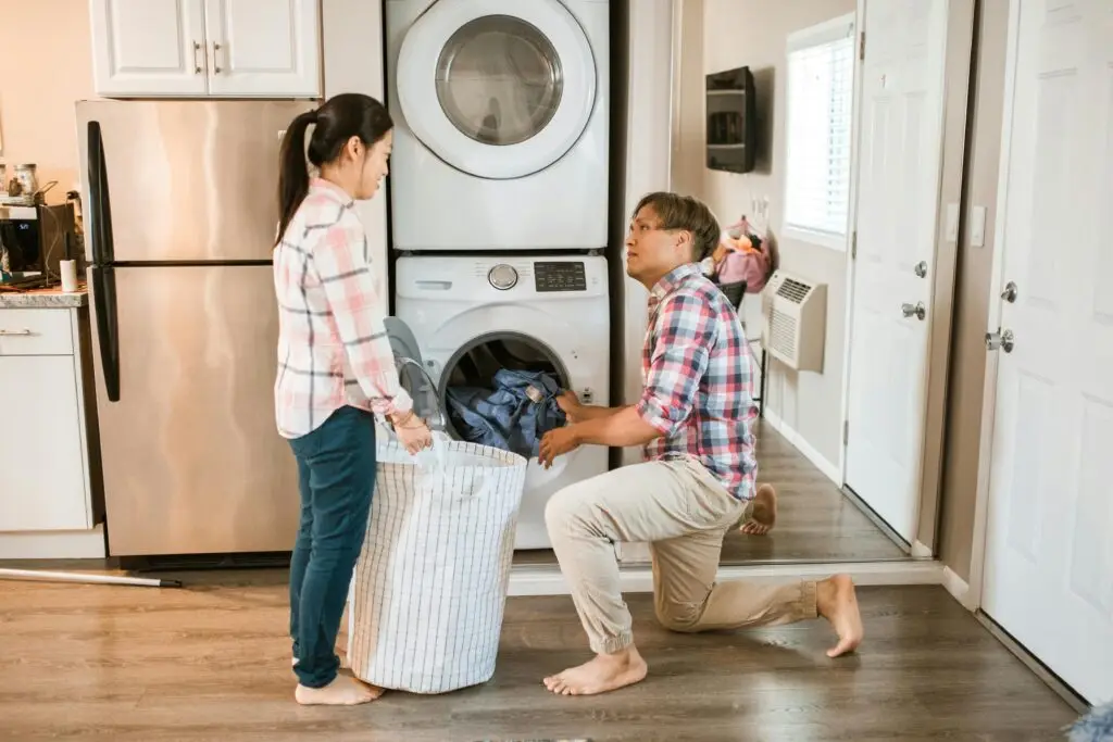 People filling washing machine